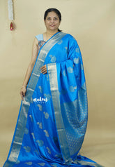 Bright blue - Sri valli pure satin silk with peacock buttas and gold zari border