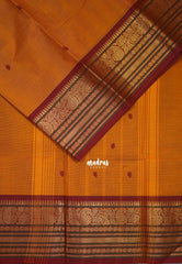 Turmeric Orange - Karthigai silk cotton buttas with mango and floral border - Best for Wedding Functions