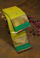 Dual Shade Yellowish Mehndi Green - Karthigai silk cotton Round Peacock and Skirt Border with buttas - Best for Wedding Functions