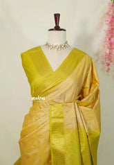 Pastel Mustard Yellow - Sowbhagya Gift silk – Soft Silk Elegance Saree with Buttas and Peacock Border - Perfect for Festive Celebration