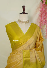 Pastel Mustard Yellow - Sowbhagya Gift silk – Soft Silk Elegance Saree with Buttas and Peacock Border - Perfect for Festive Celebration