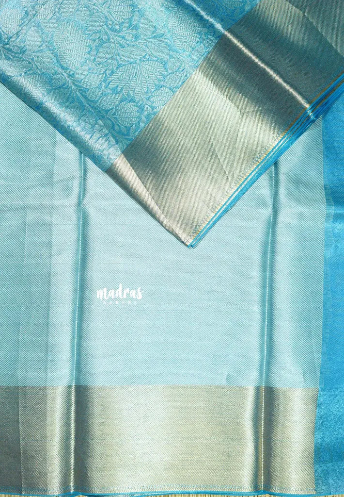 Sky Melody Blue - Ahaana -  Nita Ambani inspired semi silk with floral emboss weaving plain border