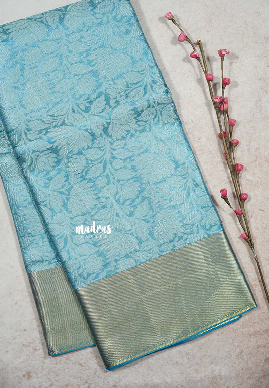 Sky Melody Blue - Ahaana -  Nita Ambani inspired semi silk with floral emboss weaving plain border