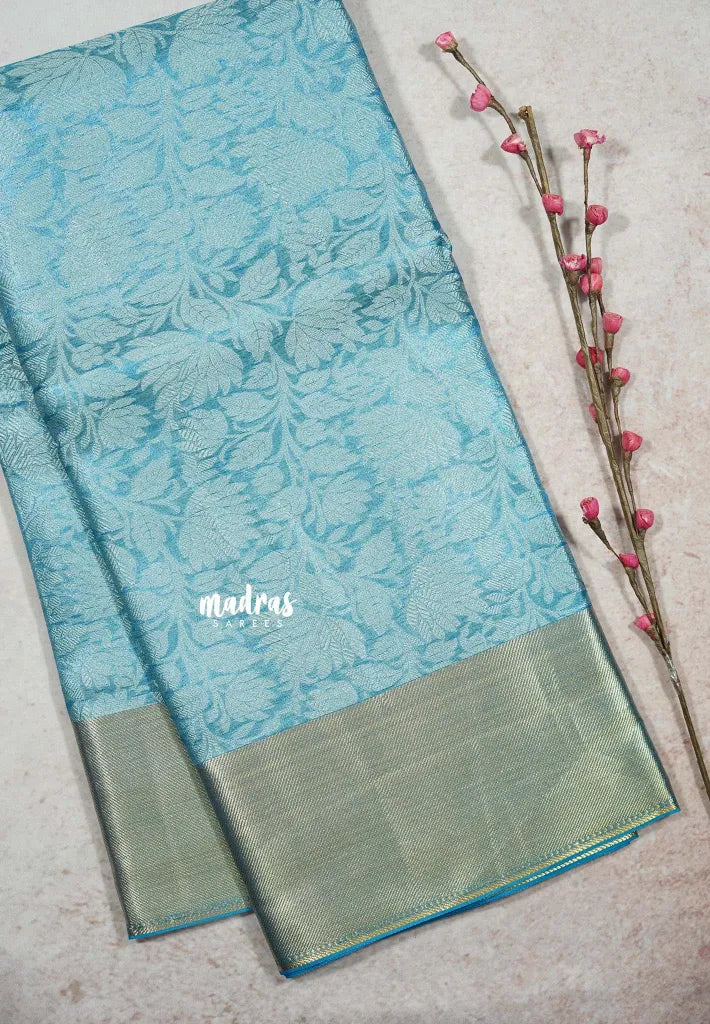 Sky Melody Blue - Ahaana -  Nita Ambani inspired semi silk with floral emboss weaving plain border