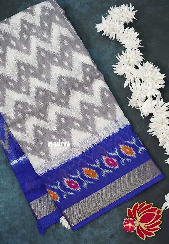 Halfwhite with Blue - Jasmine - Fancy Jute Cotton Ikkat Prints with Patola Border