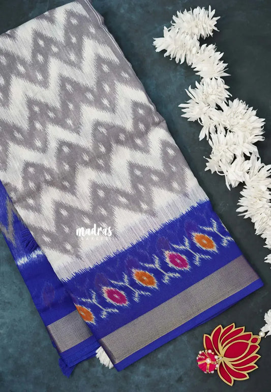 Halfwhite with Blue - Jasmine - Fancy Jute Cotton Ikkat Prints with Patola Border