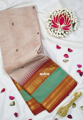 Pastel Beige Brown - Karthigai silk cotton with buttas annam small temple rettapet border - Best for Wedding Functions