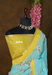 Losliya Inspired Soft Linen Cotton Saree with Aqua Blue & Floral Prints