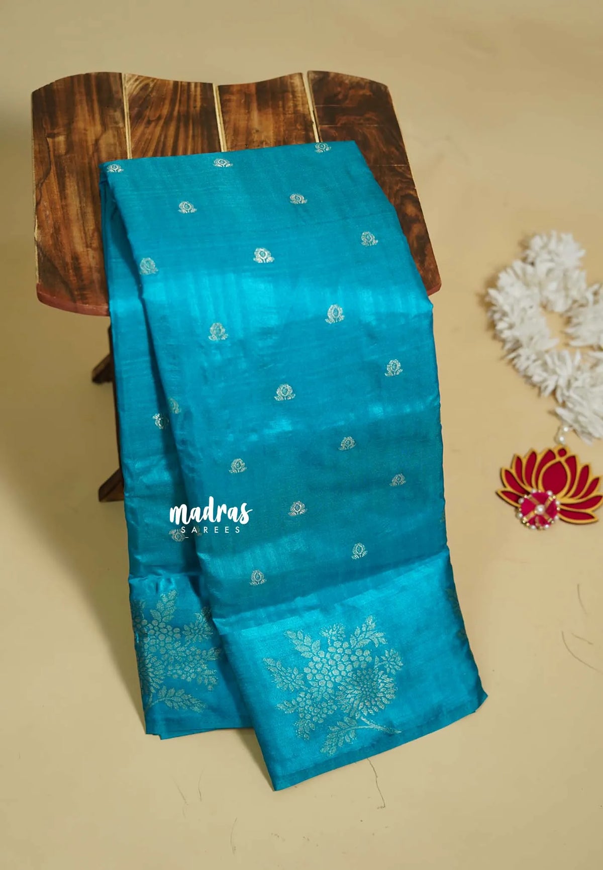 Blue - Madhuram - Soft Matka silk with grooves body and floral border with buttas