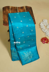 Blue - Madhuram - Soft Matka silk with grooves body and floral border with buttas