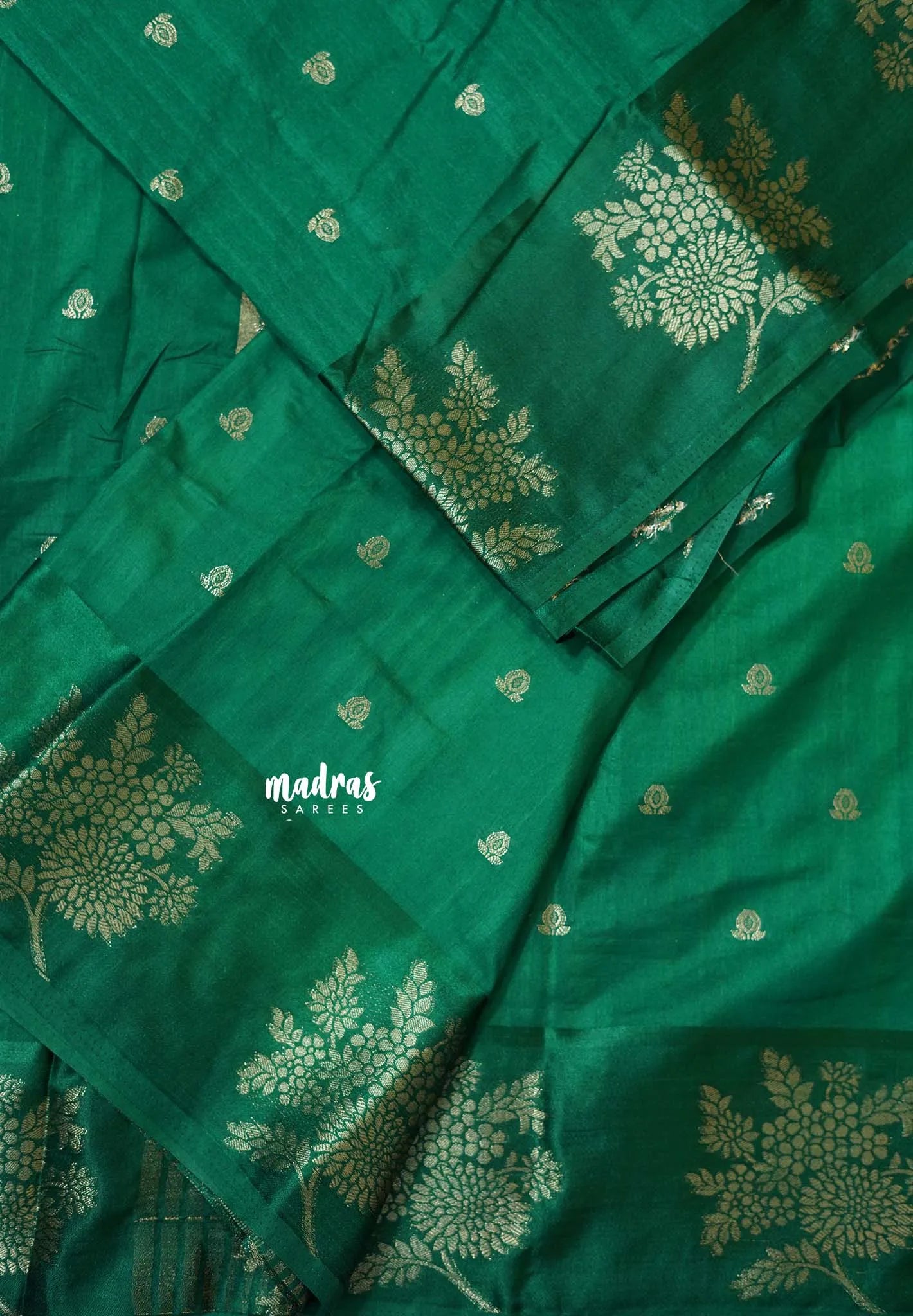 Dark Green - Madhuram - Soft Matka silk with grooves body and floral border with buttas