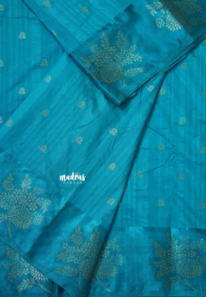 Blue - Madhuram - Soft Matka silk with grooves body and floral border with buttas