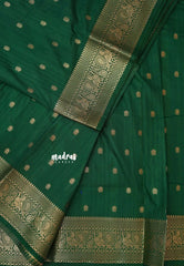 Dark Green - Madhuram - Soft Matka silk with grooves body and temple peacock border