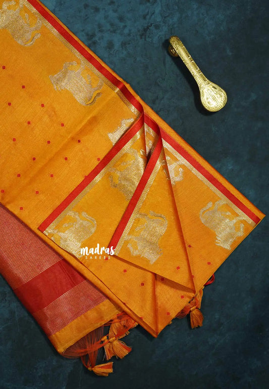 Mild orange - Manjari - Premium raw silk with full weaving buttas pichwai cow border
