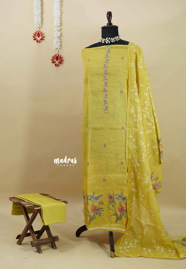 Amitha – Greenish Yellow Tissue Linen Salwar Suit with Birds Digital Prints & Hand Embroidery