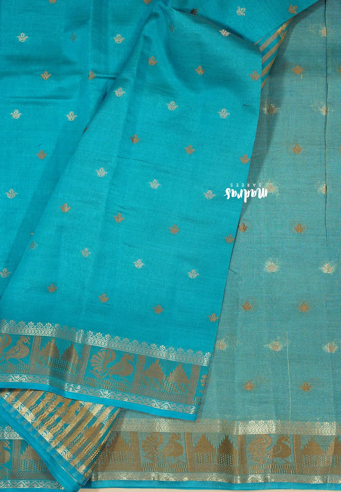 Teal Blue - Raaga - Semi Tussar Plain body with Buttas and Mayil Border