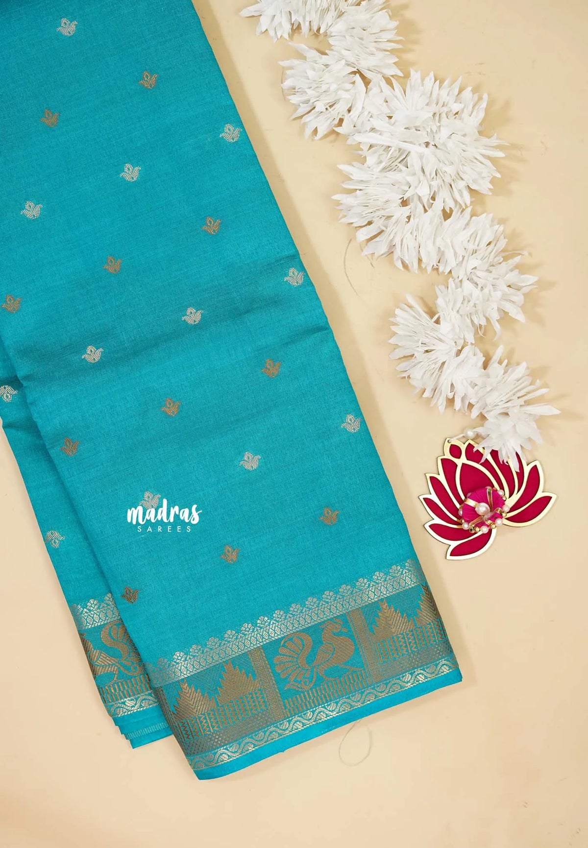 Teal Blue - Raaga - Semi Tussar Plain body with Buttas and Mayil Border