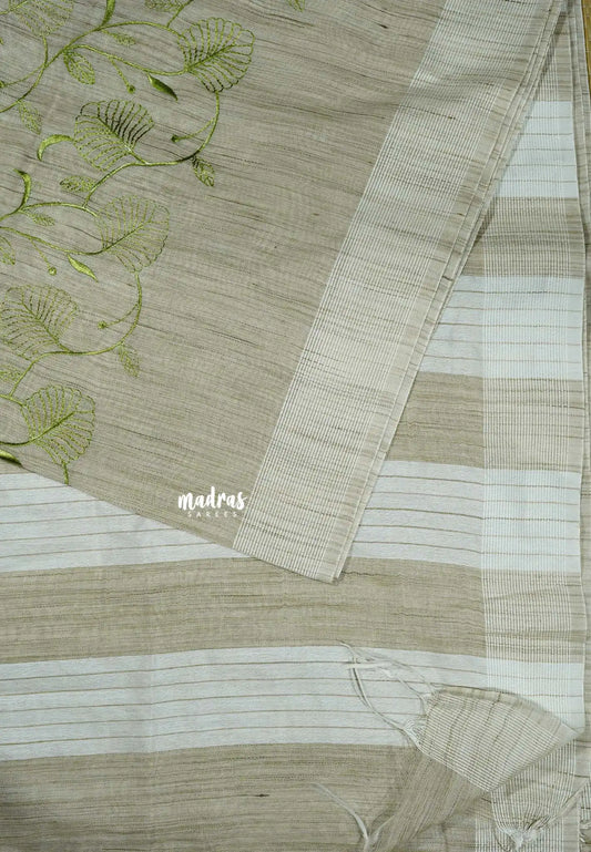 Jute beige - Sithara - Semi Tussar saree with full Green embroidery
