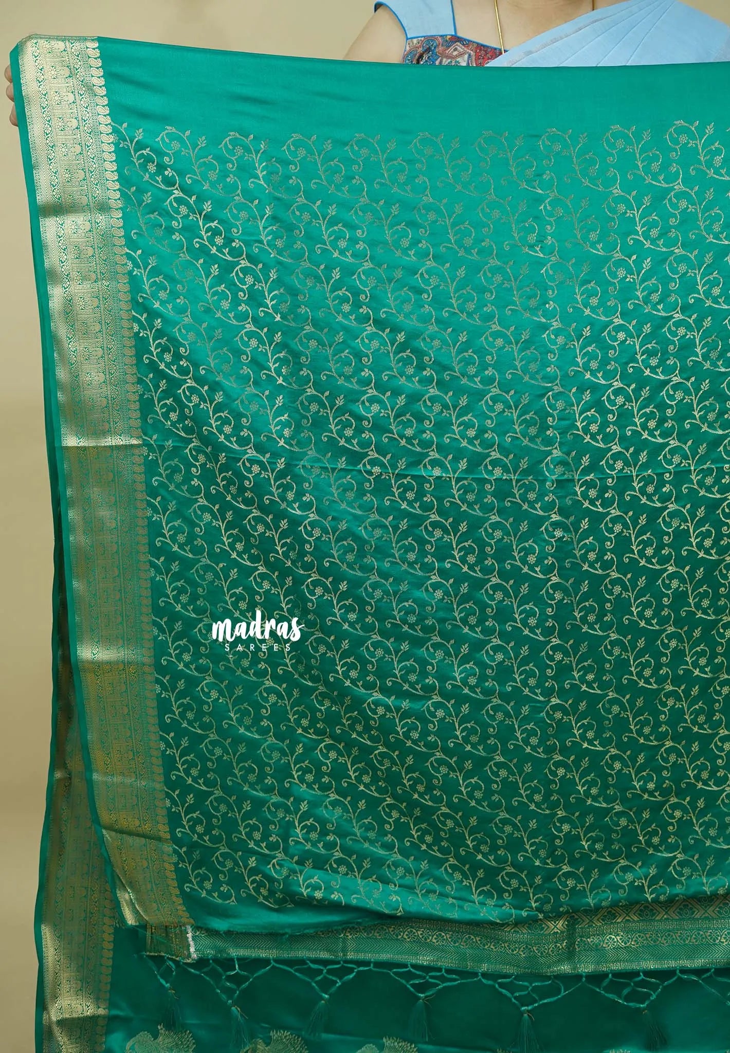 Emerald Green - Sri valli pure satin silk with peacock buttas and gold zari border