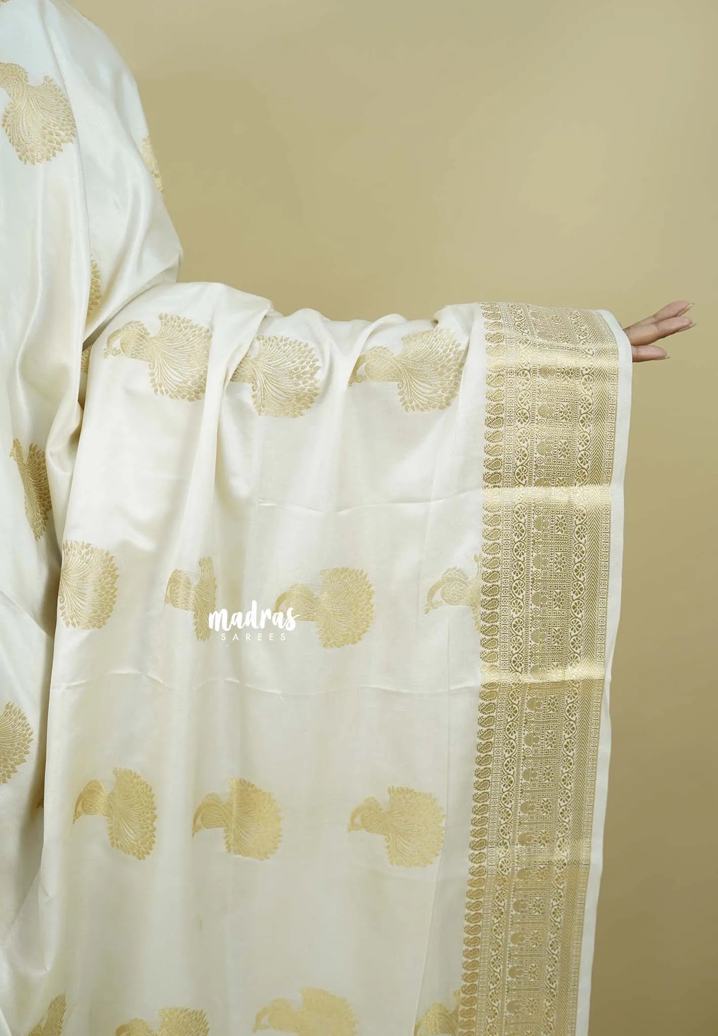 Ivory white - Sri valli pure satin silk with peacock buttas and gold zari border