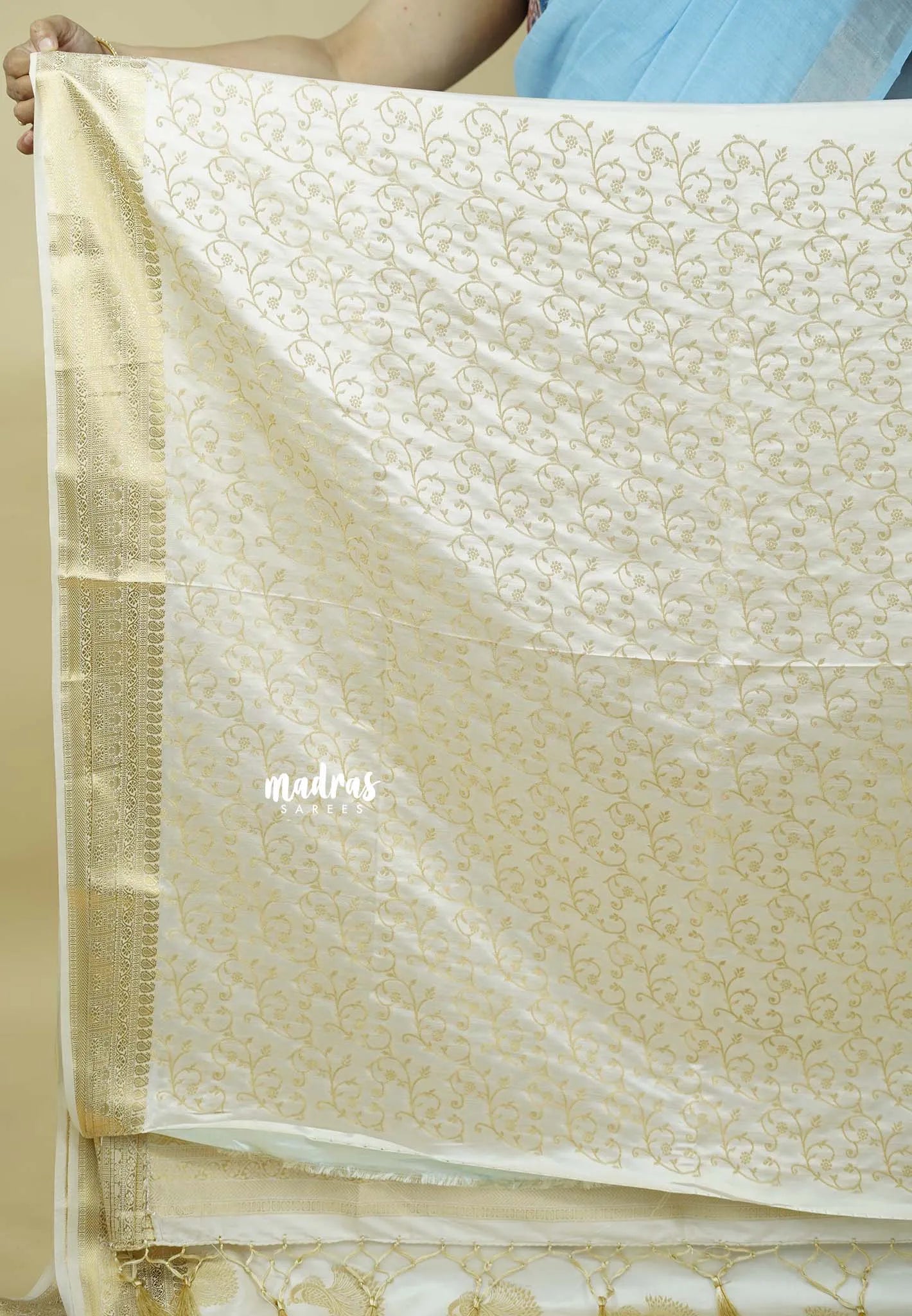 Ivory white - Sri valli pure satin silk with peacock buttas and gold zari border