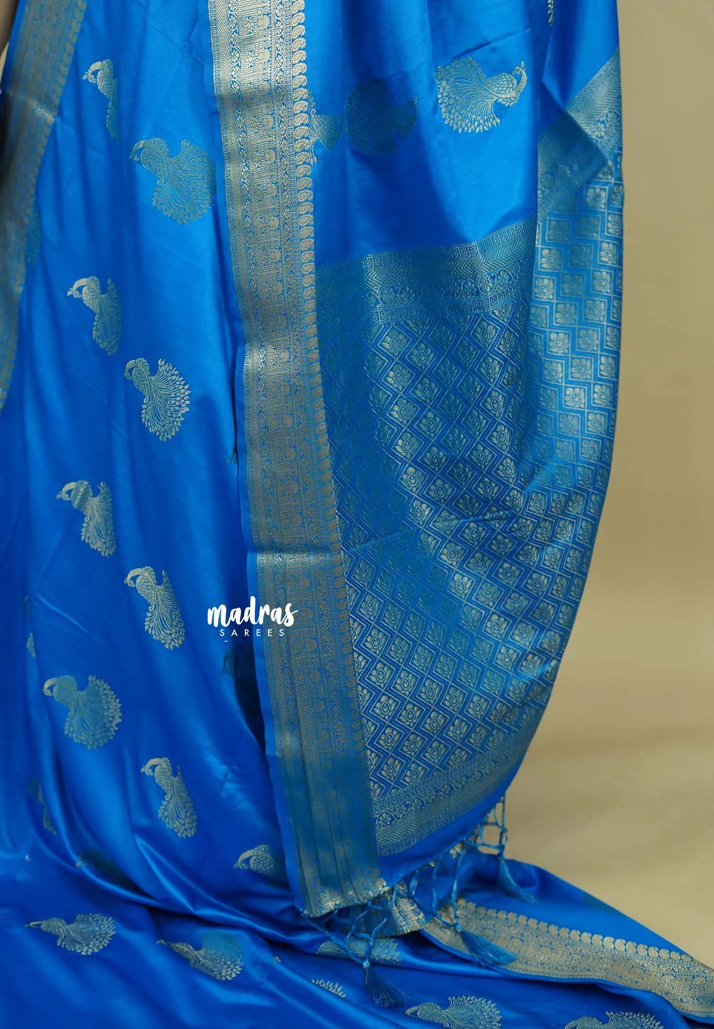Bright blue - Sri valli pure satin silk with peacock buttas and gold zari border