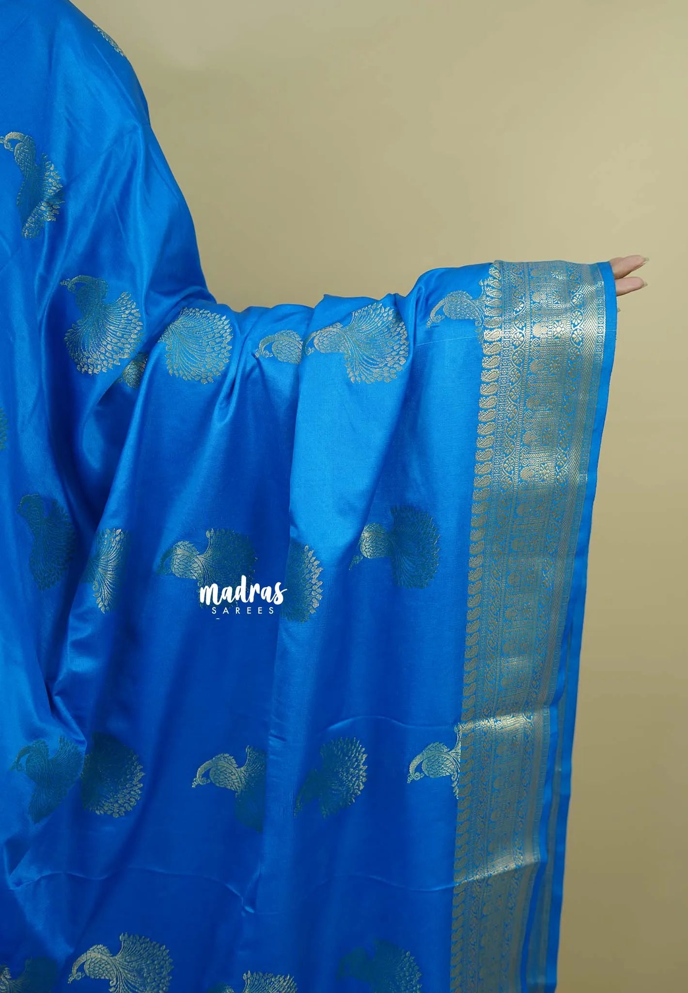 Bright blue - Sri valli pure satin silk with peacock buttas and gold zari border