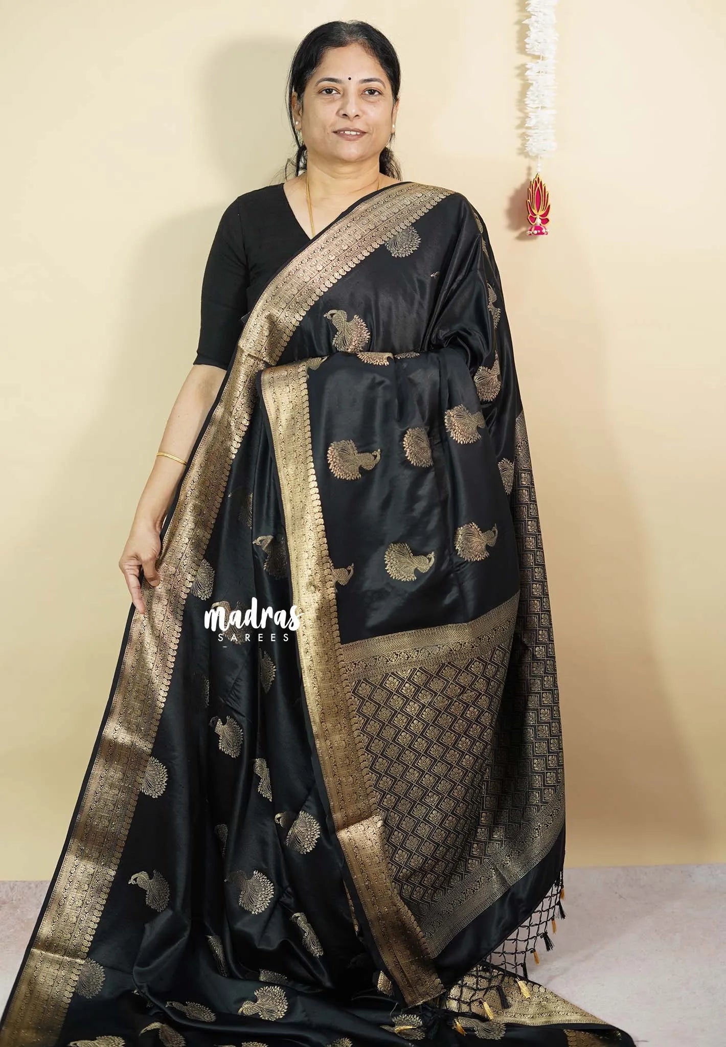 Black Pearl - Sri valli pure satin silk with peacock buttas and gold zari border