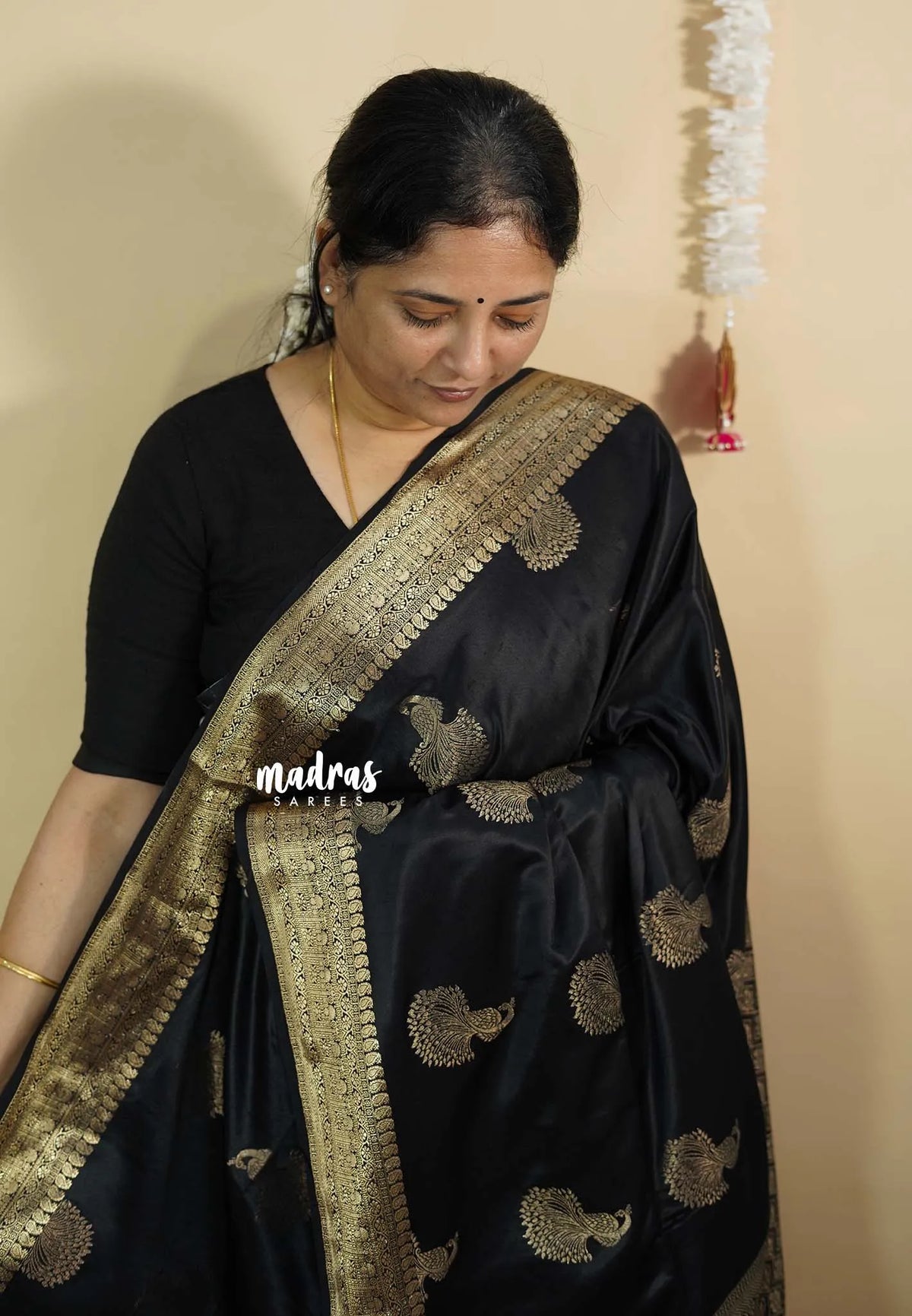 Black Pearl - Sri valli pure satin silk with peacock buttas and gold zari border