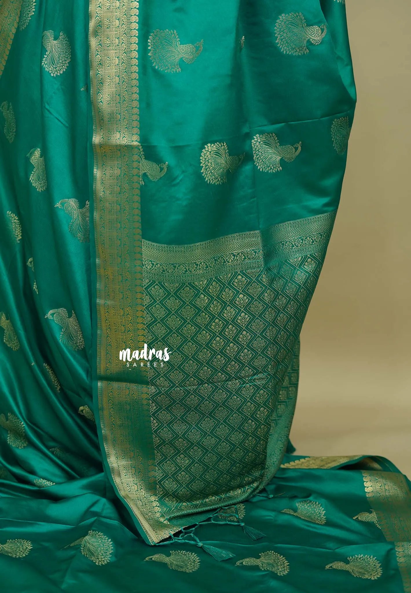 Emerald Green - Sri valli pure satin silk with peacock buttas and gold zari border