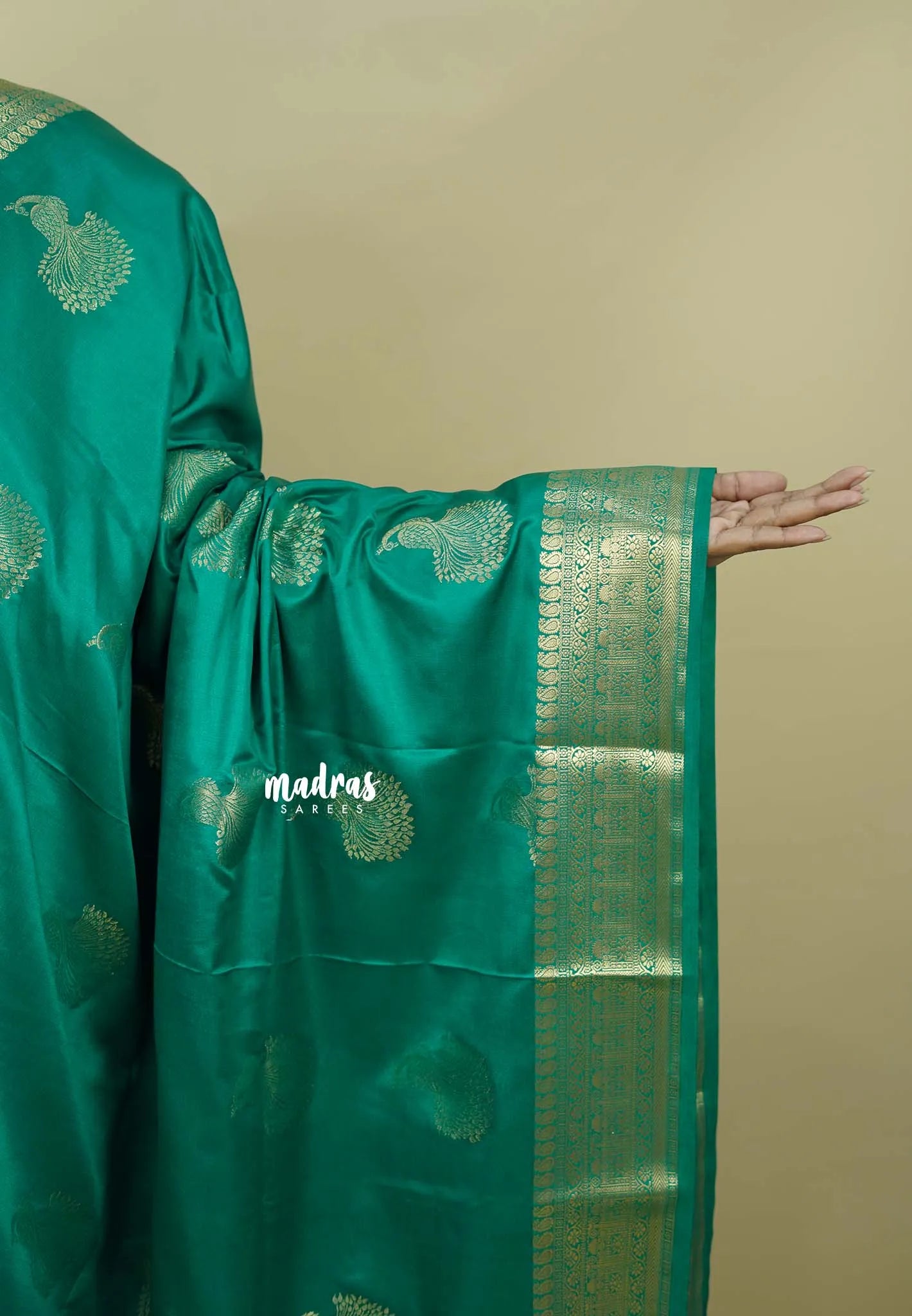 Emerald Green - Sri valli pure satin silk with peacock buttas and gold zari border