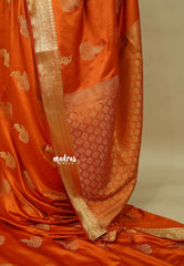 Burnt Orange - Sri valli pure satin silk with peacock buttas and gold zari border