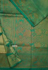 Bavanchi - Fusion of Banaras and Kanchi  Wavy body design with floral weaving border - Teal green