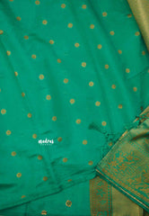 Bavanchi - Fusion of Banaras and Kanchi  Wavy body design with floral weaving border - Teal green