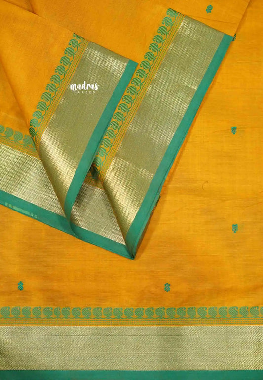 Karthigai silk cotton mango bavanji border - yellowish orange