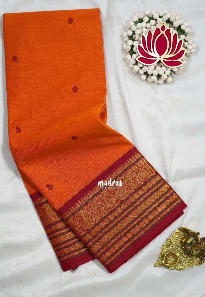 Sunset Orange - Karthigai silk cotton buttas with mango and floral border - Best for Wedding Functions