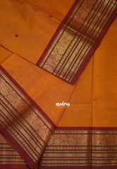 Turmeric Orange - Karthigai silk cotton buttas with mango and floral border - Best for Wedding Functions