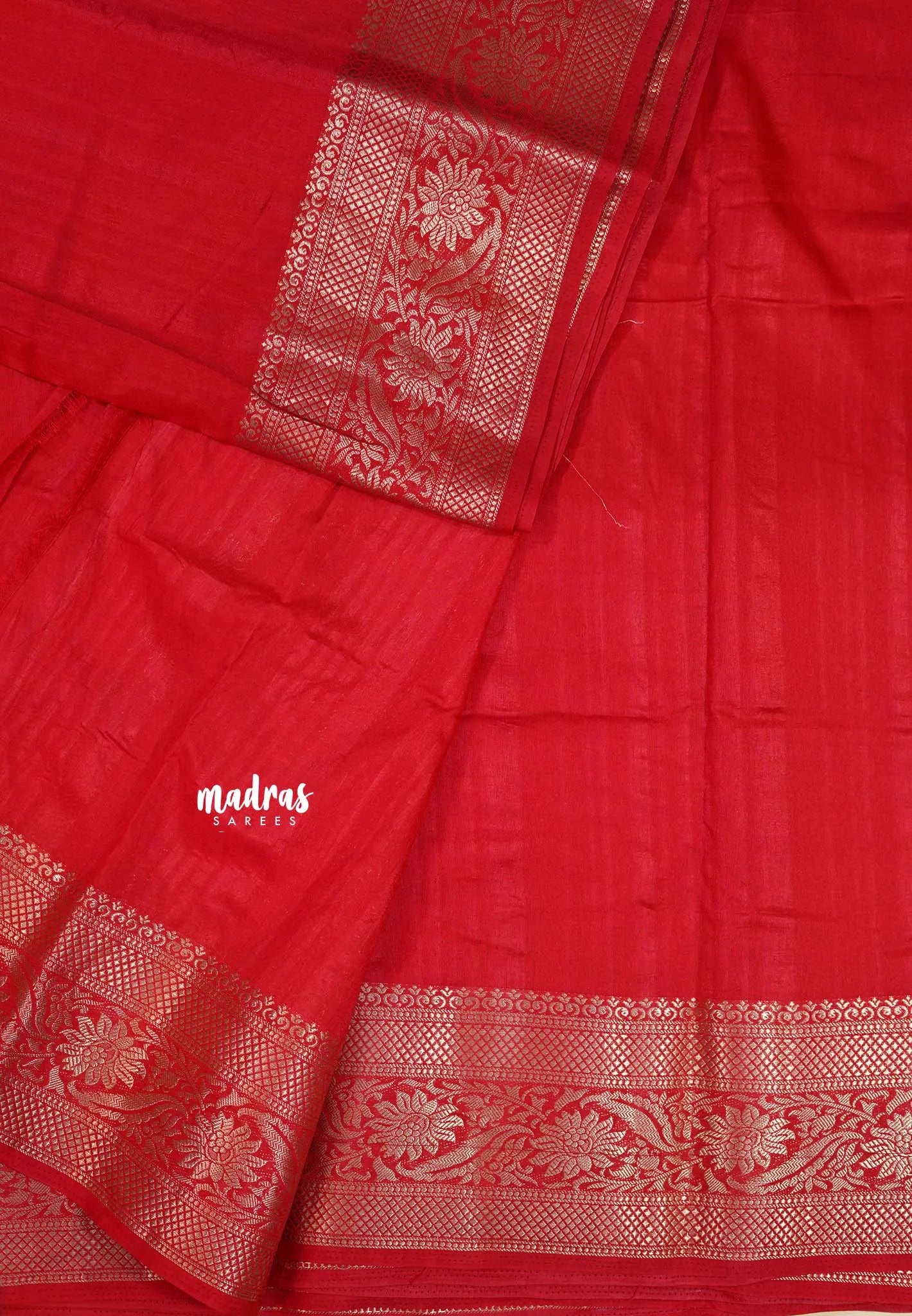 Red - Madhuram - Soft Matka silk with grooves body with traditional border