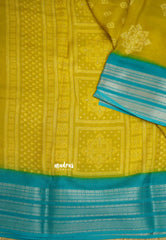 Silky Georgette with rangoli buttas - Yellow with cyan blue