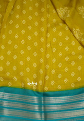 Silky Georgette with rangoli buttas - Yellow with cyan blue