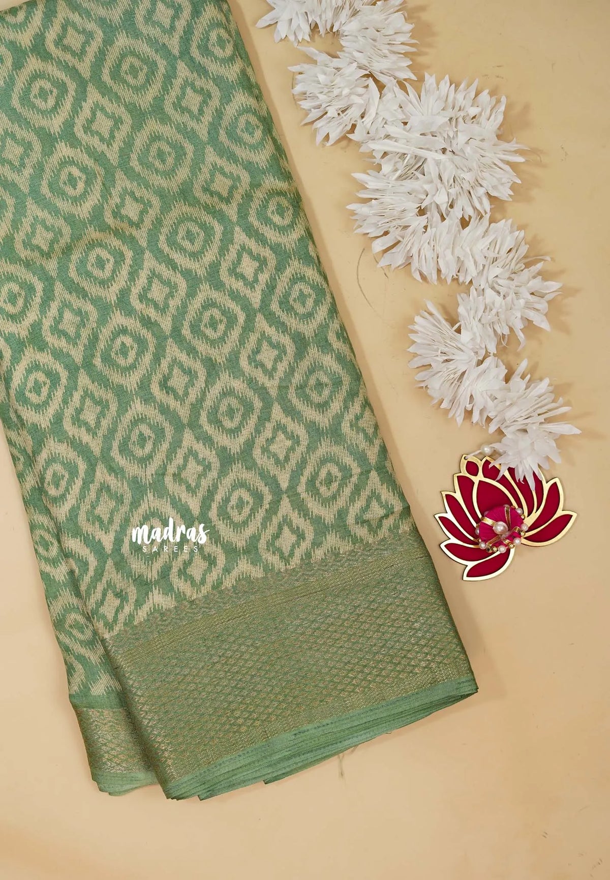 Muted Pista Green - Silky Georgette with Ikkat Prints and Zari Border