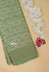 Muted Pista Green - Silky Georgette with Ikkat Prints and Zari Border