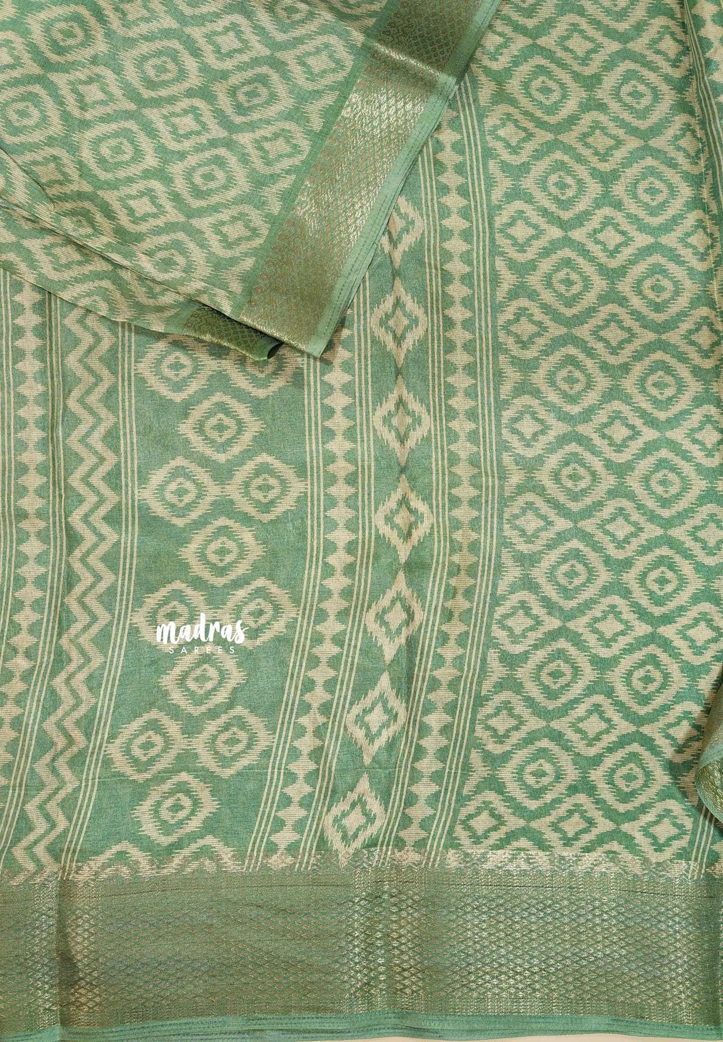 Muted Pista Green - Silky Georgette with Ikkat Prints and Zari Border