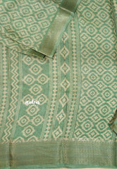 Muted Pista Green - Silky Georgette with Ikkat Prints and Zari Border
