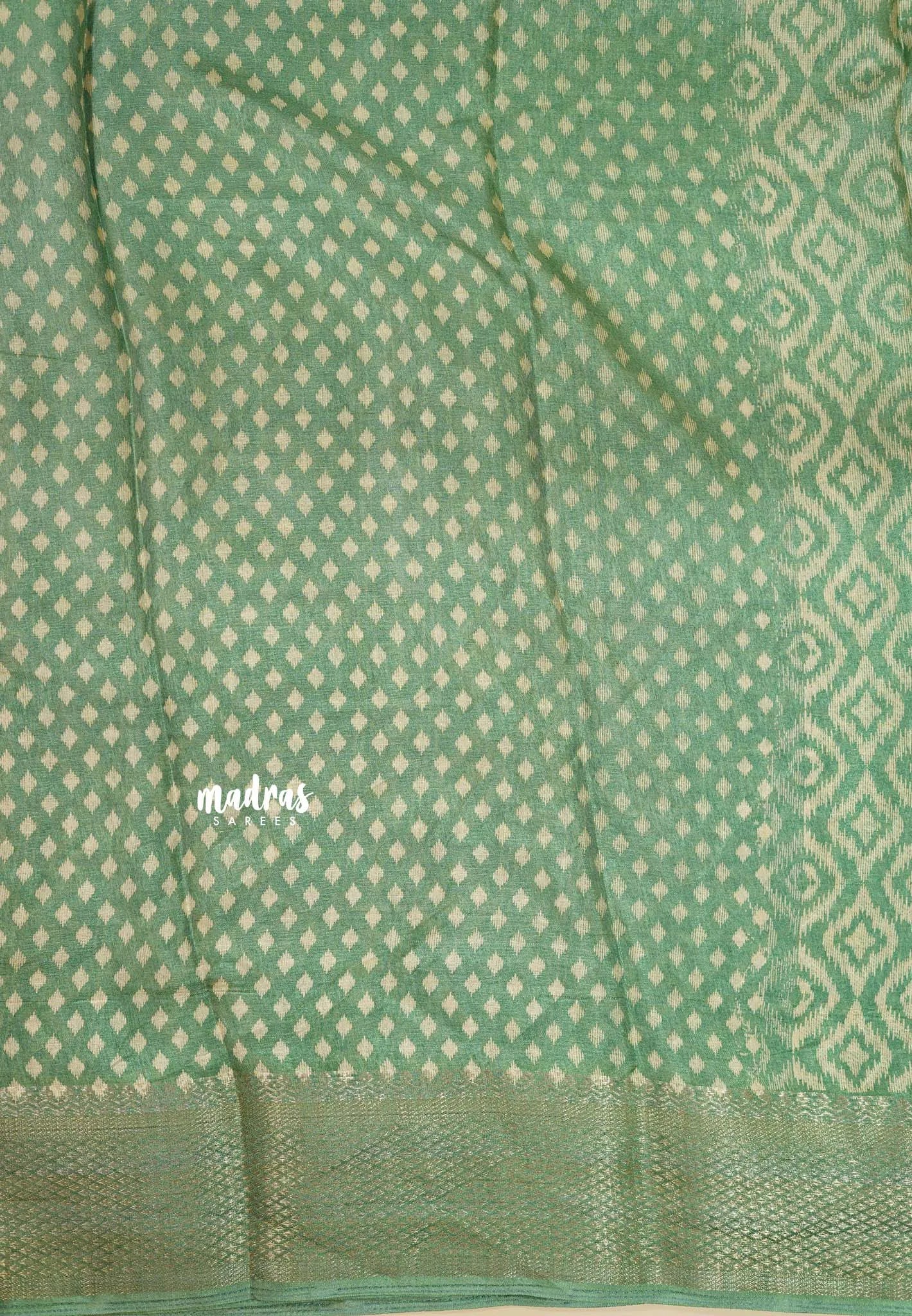 Muted Pista Green - Silky Georgette with Ikkat Prints and Zari Border