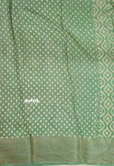 Muted Pista Green - Silky Georgette with Ikkat Prints and Zari Border