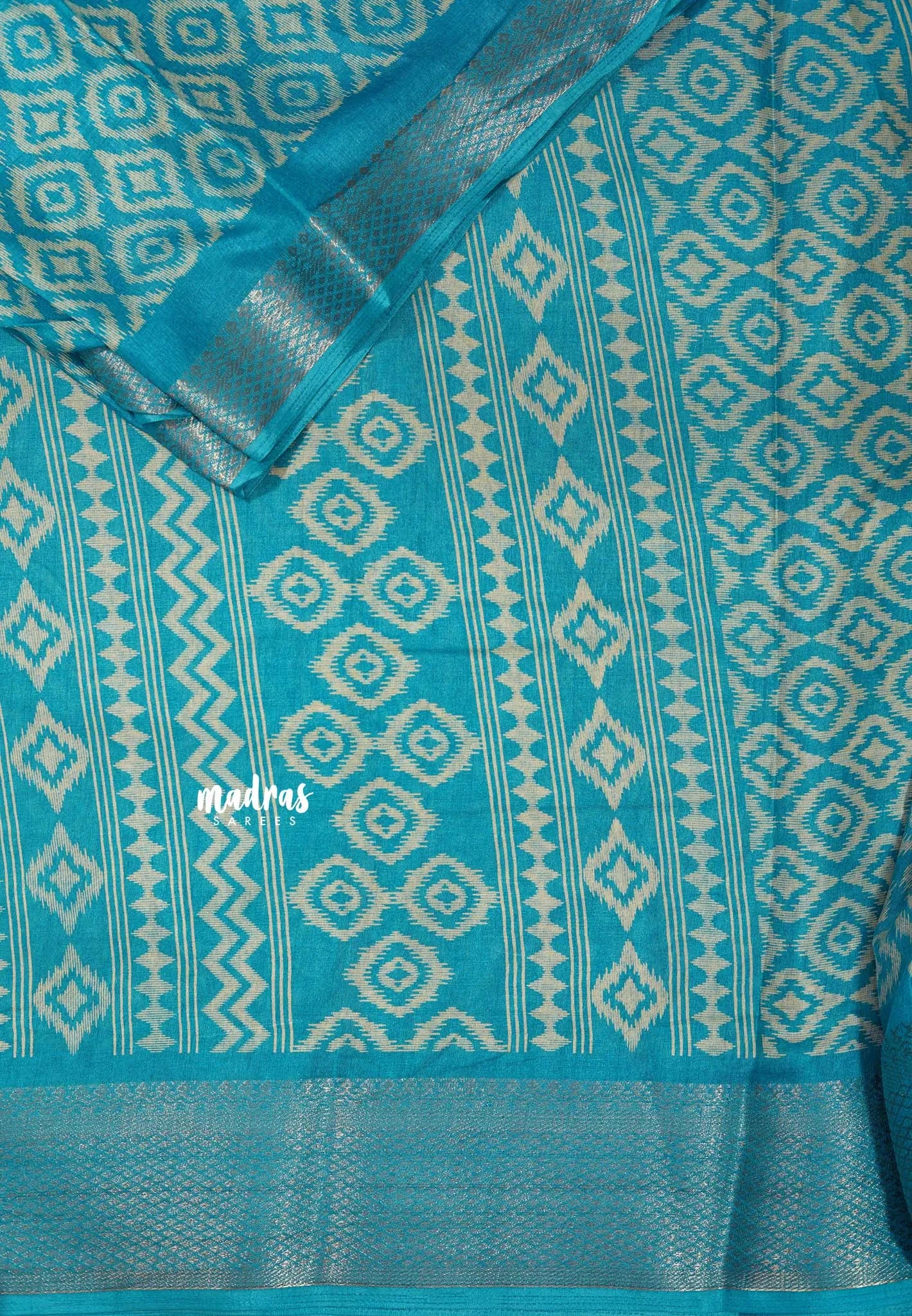 Teal Blue - Silky Georgette with Ikkat Prints and Zari Border