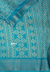 Teal Blue - Silky Georgette with Ikkat Prints and Zari Border