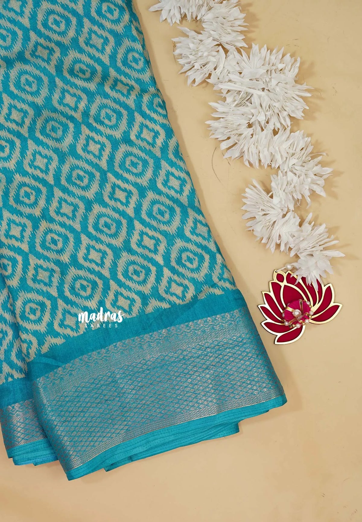Teal Blue - Silky Georgette with Ikkat Prints and Zari Border