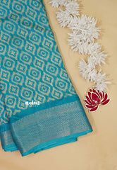 Teal Blue - Silky Georgette with Ikkat Prints and Zari Border